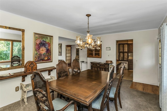 20 Wensley Rd, Plainview, NY 11803 - carpeted dining area featuring a chandelier and crown molding