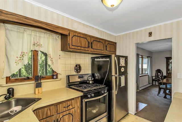 20 Wensley Rd, Plainview, NY 11803 - kitchen with stainless steel appliances, wallpapered walls, light countertops, crown molding, and backsplash