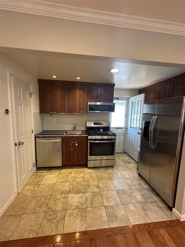 33-13 202nd St, Bayside, NY 11361 - kitchen featuring appliances with stainless steel finishes, crown molding, recessed lighting, decorative backsplash, and dark brown cabinetry