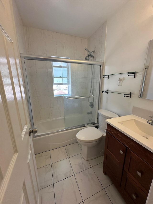 33-13 202nd St, Bayside, NY 11361 - bathroom featuring marble look tiles, vanity, and bath / shower combo with glass door