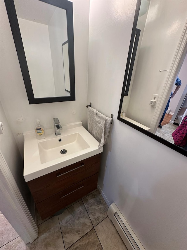 33-13 202nd St, Bayside, NY 11361 - bathroom with vanity and a baseboard heating unit