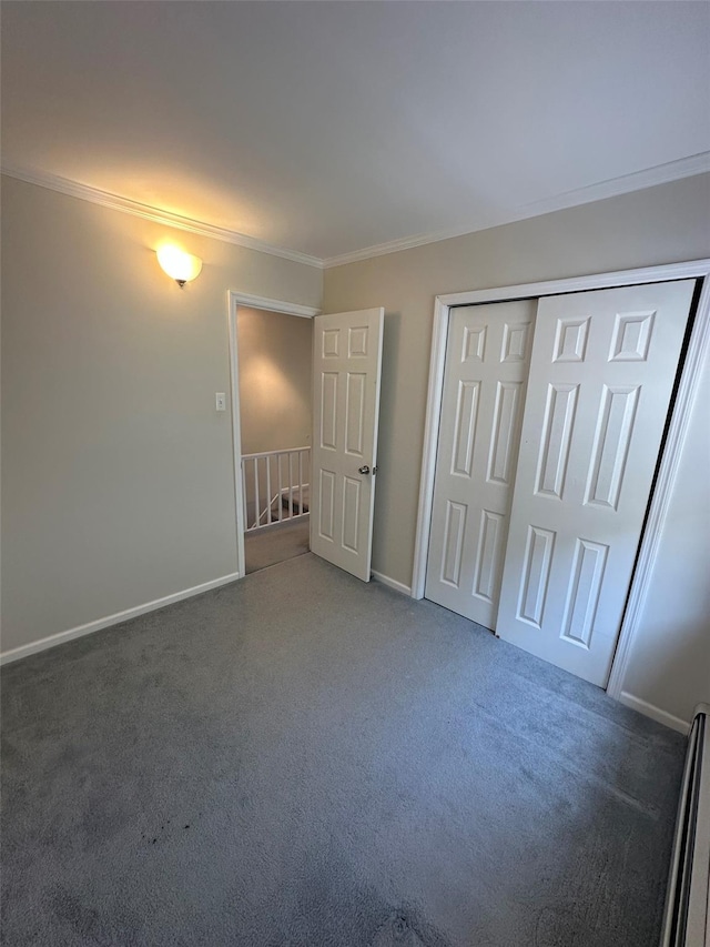 33-13 202nd St, Bayside, NY 11361 - unfurnished bedroom featuring crown molding, carpet, and a closet