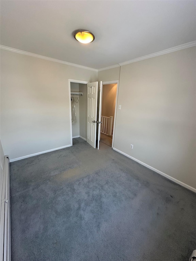 33-13 202nd St, Bayside, NY 11361 - unfurnished bedroom featuring crown molding, a closet, dark colored carpet, and baseboard heating