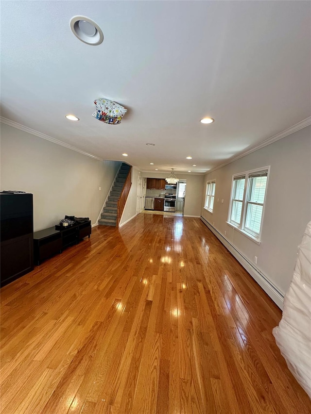 33-13 202nd St, Bayside, NY 11361 - unfurnished living room featuring ornamental molding, stairway, light wood finished floors, baseboard heating, and recessed lighting