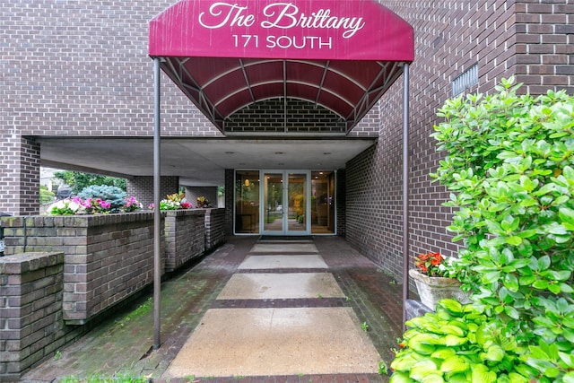 171 S Middle Neck Rd Unit 1F, Great Neck, NY 11021 - property entrance with french doors and brick siding
