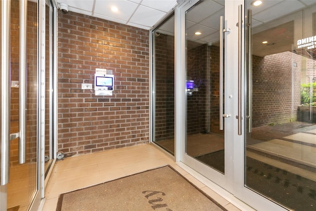 171 S Middle Neck Rd Unit 1F, Great Neck, NY 11021 - bathroom featuring brick wall and recessed lighting