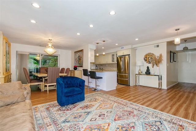 171 S Middle Neck Rd Unit 1F, Great Neck, NY 11021 - living area with light wood-style flooring, recessed lighting, and a chandelier