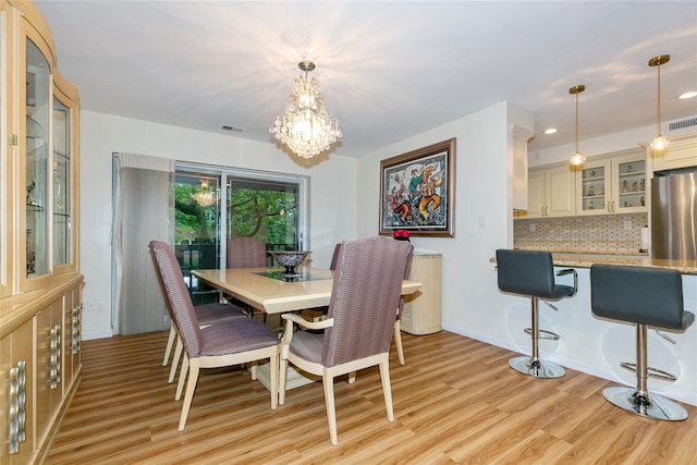 171 S Middle Neck Rd Unit 1F, Great Neck, NY 11021 - dining room with light wood-type flooring, a chandelier, and recessed lighting