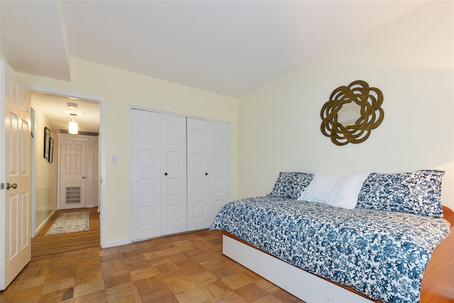 171 S Middle Neck Rd Unit 1F, Great Neck, NY 11021 - bedroom with baseboards and a closet