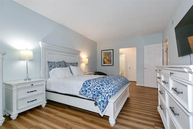 171 S Middle Neck Rd Unit 1F, Great Neck, NY 11021 - bedroom with light wood-style floors and connected bathroom