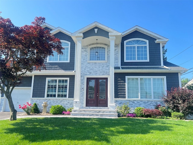 5 Vera Ave, Plainview, NY 11803 - view of front of home with stone siding, a front lawn, french doors, and a garage