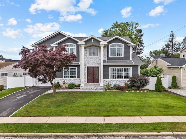 5 Vera Ave, Plainview, NY 11803 - view of front of home with stone siding, french doors, driveway, and a garage