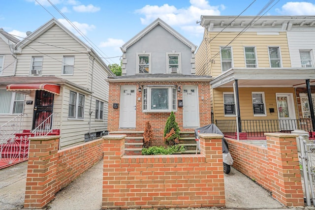 592 E 39th St, Brooklyn, NY 11203 - view of front of home featuring entry steps, covered porch, brick siding, and stucco siding