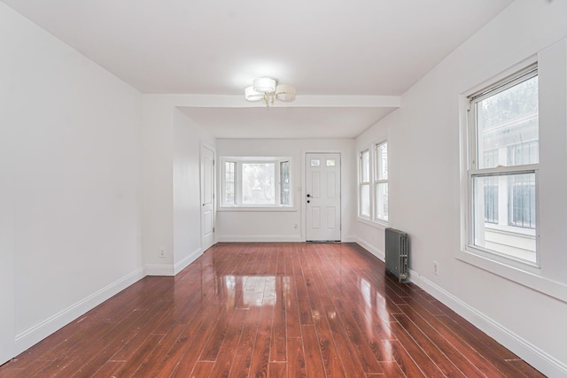 592 E 39th St, Brooklyn, NY 11203 - entrance foyer featuring radiator and dark wood finished floors