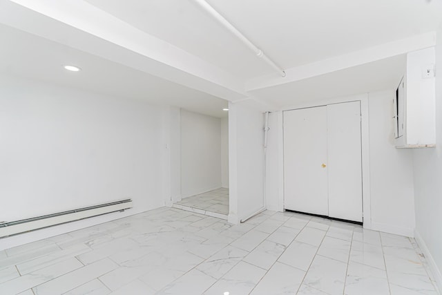 592 E 39th St, Brooklyn, NY 11203 - unfurnished bedroom featuring light marble finish flooring, a baseboard radiator, recessed lighting, and a closet