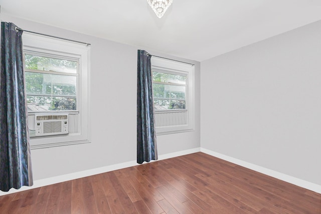 592 E 39th St, Brooklyn, NY 11203 - spare room with wood finished floors and cooling unit
