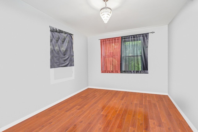 592 E 39th St, Brooklyn, NY 11203 - empty room featuring wood finished floors and baseboards