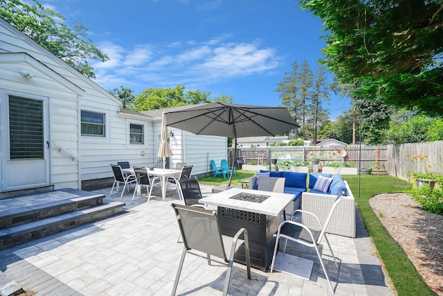 15 Roosevelt Blvd, East Patchogue, NY 11772 - fenced backyard with outdoor dining space, a patio, and an outdoor living space with a fire pit