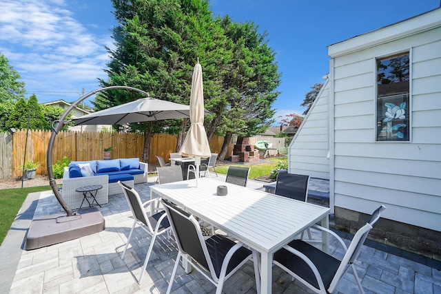 15 Roosevelt Blvd, East Patchogue, NY 11772 - fenced backyard with an outdoor hangout area, outdoor dining area, and a patio