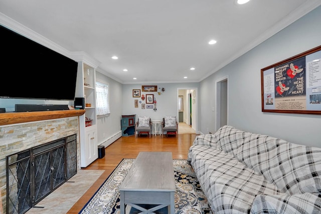 15 Roosevelt Blvd, East Patchogue, NY 11772 - living area featuring ornamental molding, light wood-style flooring, a baseboard heating unit, recessed lighting, and a fireplace