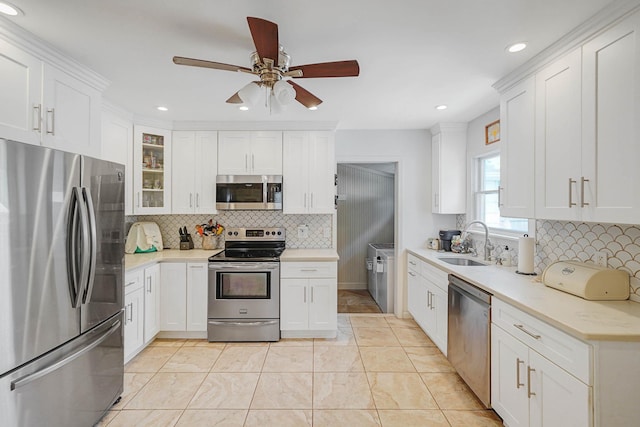 15 Roosevelt Blvd, East Patchogue, NY 11772 - kitchen with appliances with stainless steel finishes, tasteful backsplash, ceiling fan, white cabinets, and recessed lighting