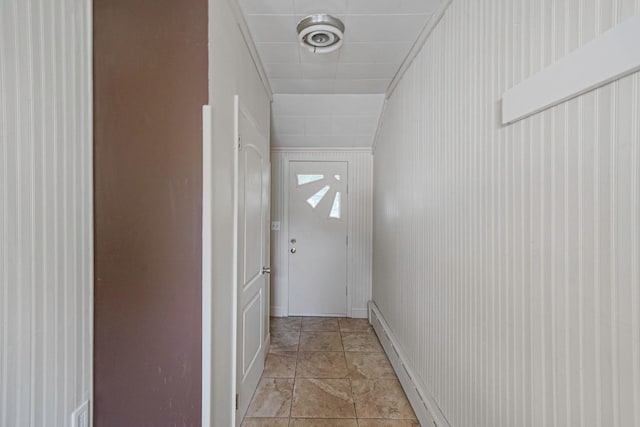 15 Roosevelt Blvd, East Patchogue, NY 11772 - doorway to outside featuring a baseboard heating unit