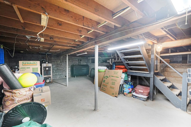 15 Roosevelt Blvd, East Patchogue, NY 11772 - unfinished basement featuring oil tank and stairs