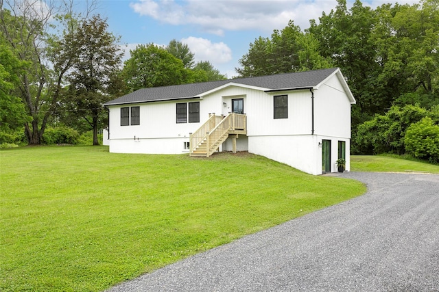 47 Clay Hill Rd, Tivoli, NY 12583 - view of front of property featuring driveway, a front lawn, view of wooded area, and roof with shingles
