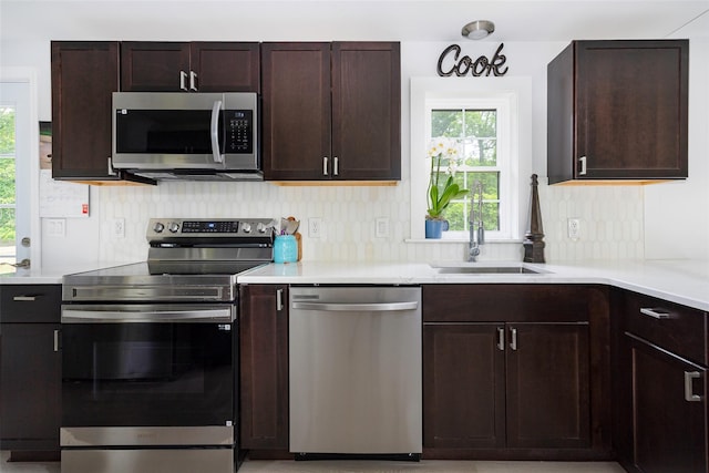 47 Clay Hill Rd, Tivoli, NY 12583 - kitchen with stainless steel appliances, dark brown cabinetry, and light countertops