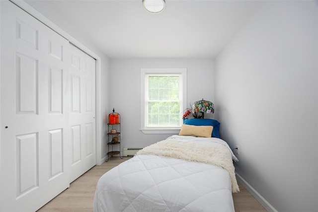 47 Clay Hill Rd, Tivoli, NY 12583 - bedroom featuring a baseboard radiator, light wood finished floors, and a closet
