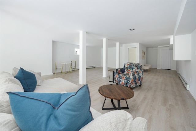 47 Clay Hill Rd, Tivoli, NY 12583 - living room with a baseboard heating unit and light wood-style flooring