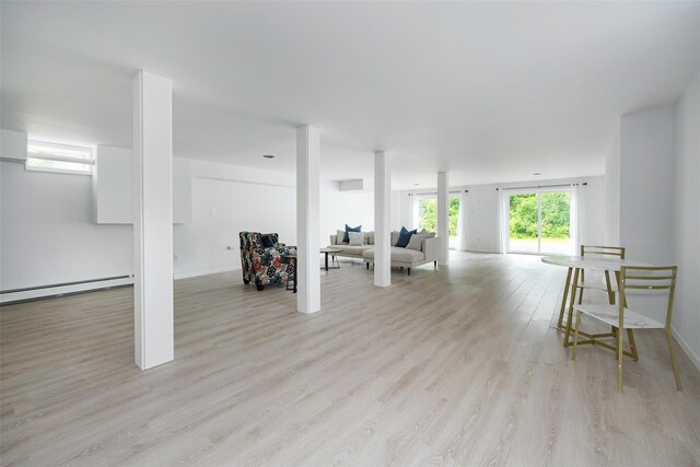 47 Clay Hill Rd, Tivoli, NY 12583 - living room featuring light wood-style floors and a baseboard heating unit
