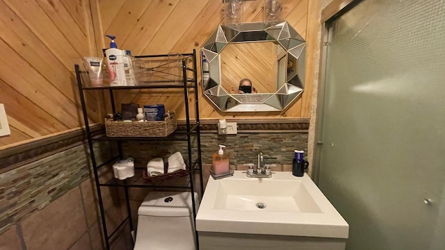 31 N Wayne Ave, West Haverstraw, NY 10993 - bathroom with vanity, tasteful backsplash, and wood walls