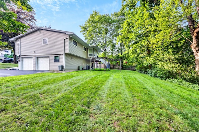5 Medford Pl, Nanuet, NY 10954 - view of home's exterior with an attached garage, driveway, and a yard