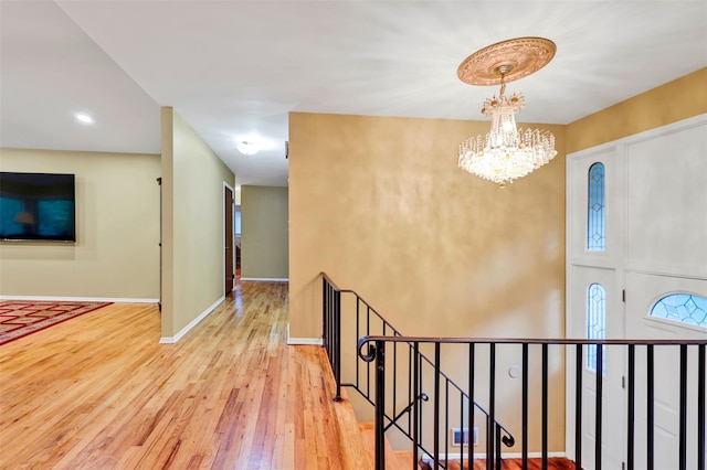 5 Medford Pl, Nanuet, NY 10954 - hallway with an upstairs landing, a chandelier, and wood-type flooring