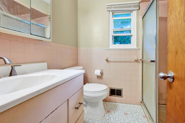 5 Medford Pl, Nanuet, NY 10954 - bathroom featuring tile walls, vanity, a shower stall, and wainscoting