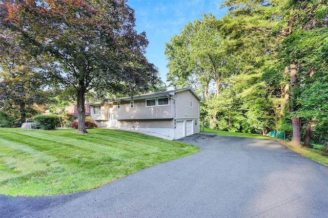 5 Medford Pl, Nanuet, NY 10954 - raised ranch featuring a garage, driveway, and a front lawn