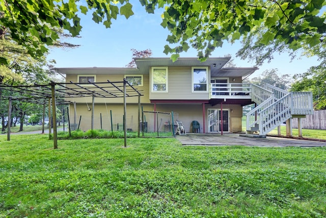 5 Medford Pl, Nanuet, NY 10954 - rear view of house featuring a wooden deck, stairway, and a patio