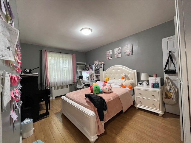252-23 63rd Ave Unit 1Fl, Little Neck, NY 11362 - bedroom featuring radiator and light wood finished floors