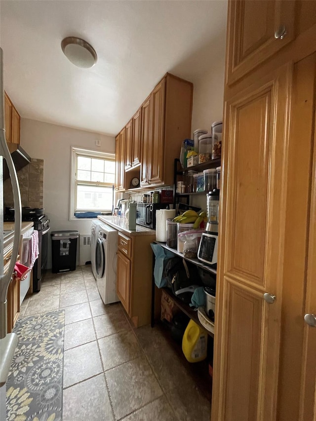 252-23 63rd Ave Unit 1Fl, Little Neck, NY 11362 - laundry area with washer / clothes dryer and light tile patterned floors