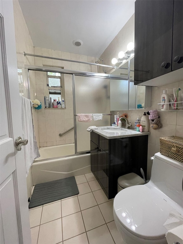 252-23 63rd Ave Unit 1Fl, Little Neck, NY 11362 - bathroom with tile patterned flooring, shower / bath combination with glass door, vanity, tile walls, and tasteful backsplash