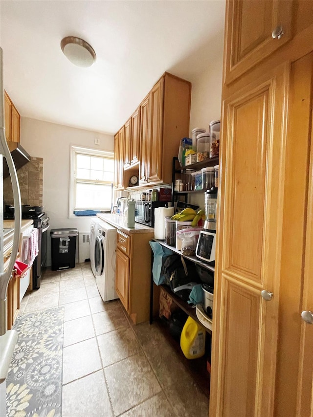 252-23 63rd Ave Unit 1081, Little Neck, NY 11362 - laundry area with light tile patterned floors