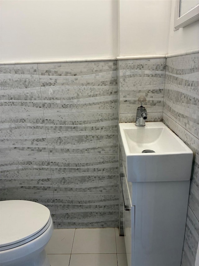 141-31 25th Rd, Flushing, NY 11354 - half bathroom with vanity, tile patterned flooring, tile walls, and wainscoting