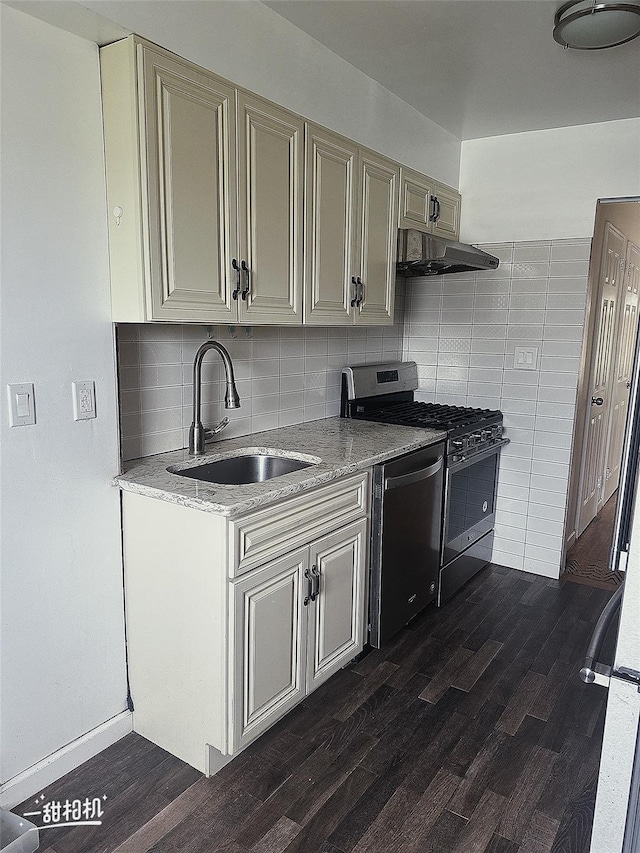 141-31 25th Rd, Flushing, NY 11354 - kitchen with appliances with stainless steel finishes, under cabinet range hood, dark wood-type flooring, and cream cabinets