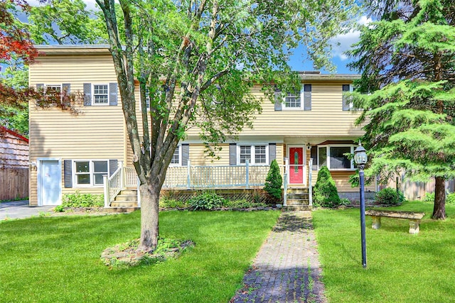 89 Circuit Rd, Bellport, NY 11713 - view of front of house featuring a front yard and a deck