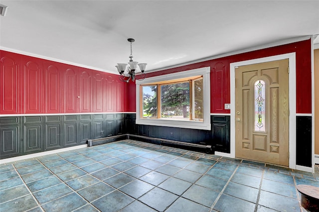 89 Circuit Rd, Bellport, NY 11713 - entryway featuring a chandelier, wainscoting, and ornamental molding