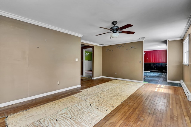 89 Circuit Rd, Bellport, NY 11713 - unfurnished room featuring wood-type flooring, ceiling fan, crown molding, and a baseboard radiator
