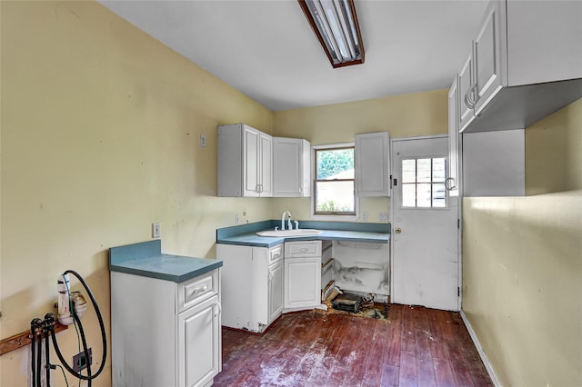 89 Circuit Rd, Bellport, NY 11713 - kitchen featuring dark wood-type flooring and white cabinets