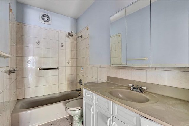 89 Circuit Rd, Bellport, NY 11713 - full bathroom featuring vanity, tub / shower combination, tile patterned floors, tile walls, and backsplash