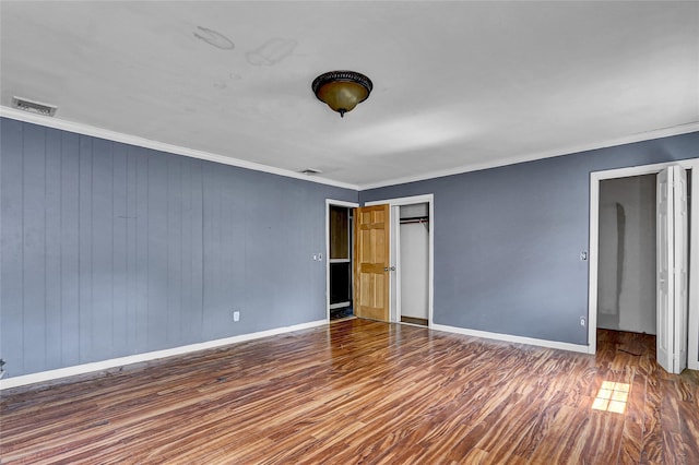 89 Circuit Rd, Bellport, NY 11713 - unfurnished bedroom featuring wood finished floors, crown molding, and a closet